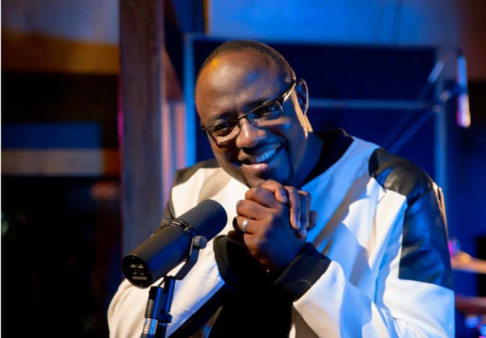 Philip Olaomi leading worship in the studio